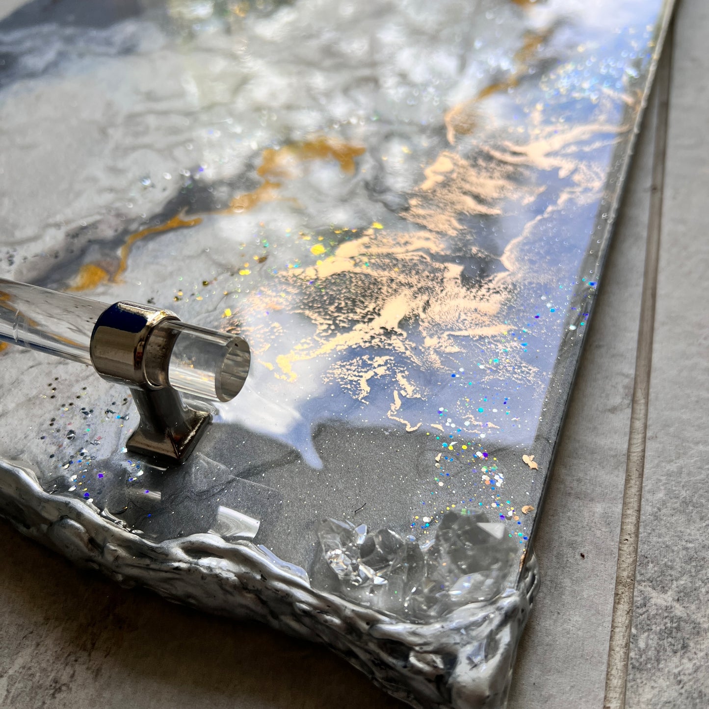 Neutral luxury tray with silver lucite handles