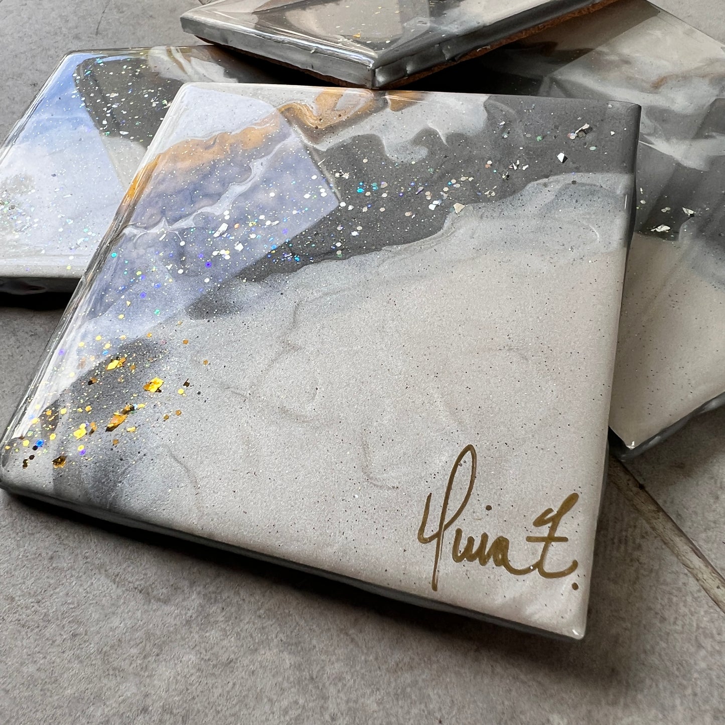 4 pc coasters in white, grey, gold