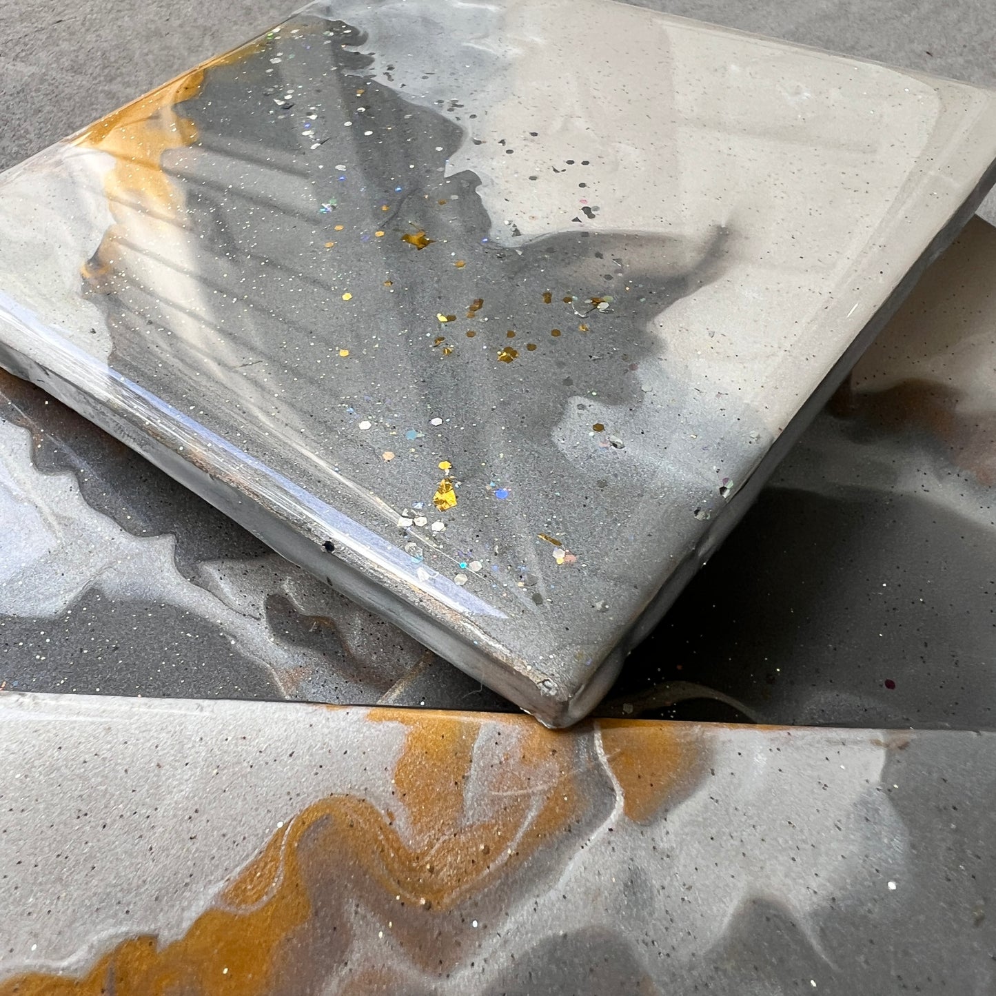 4 pc coasters in white, grey, gold
