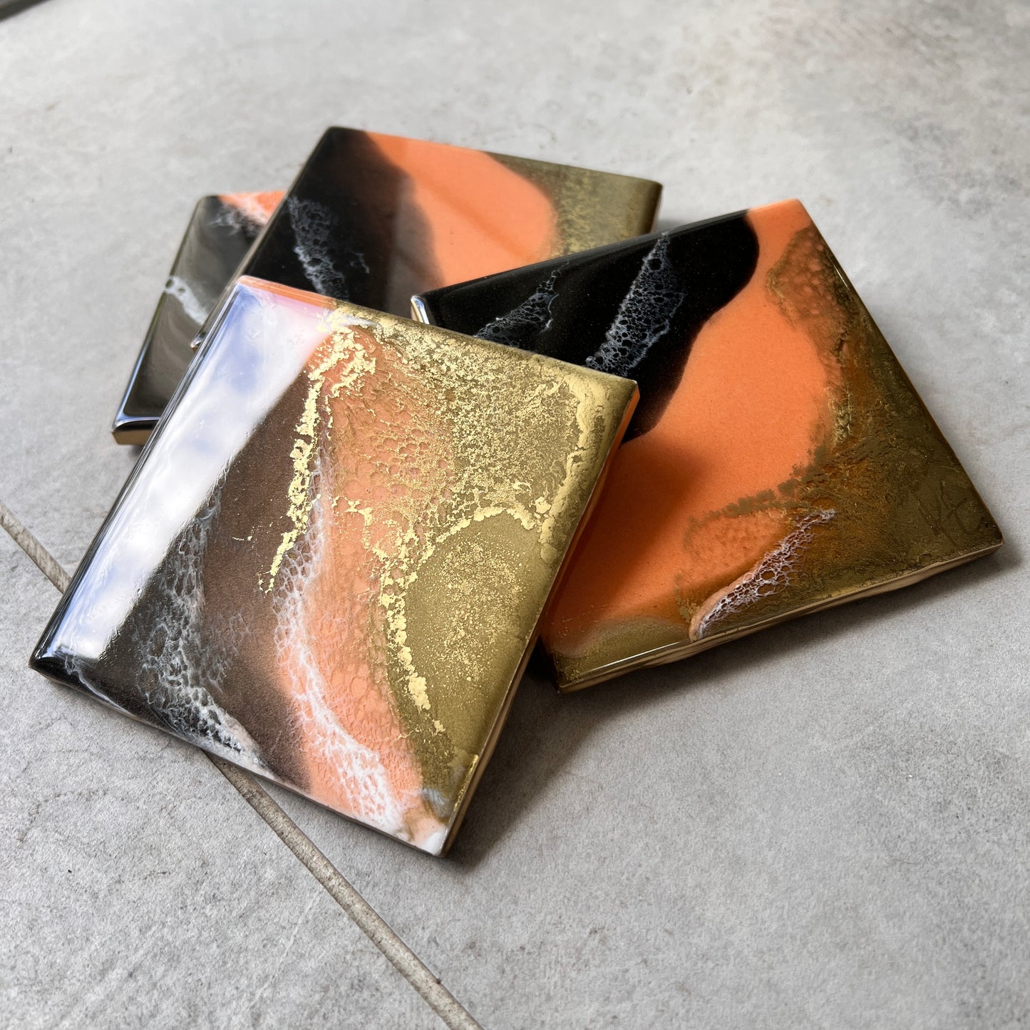 4 pc coasters in coral, brown & gold