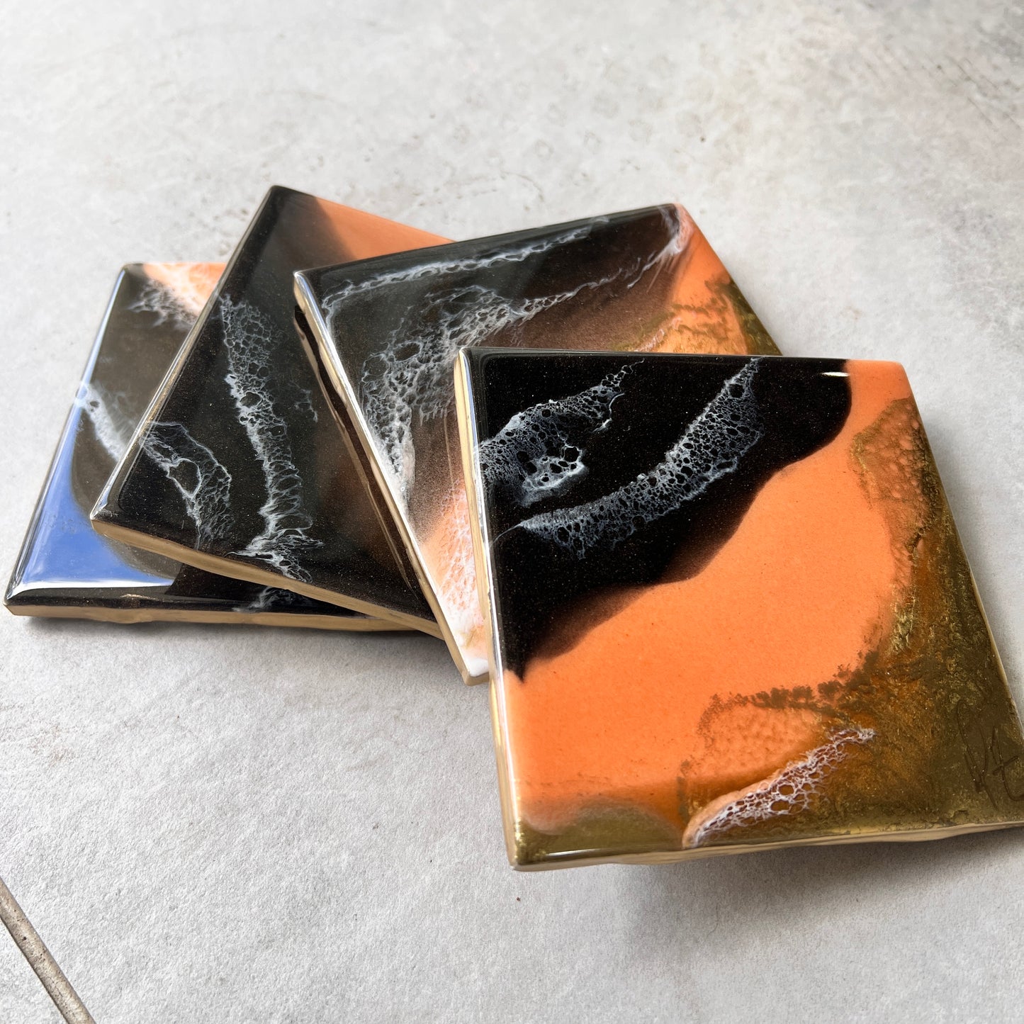 4 pc coasters in coral, brown & gold