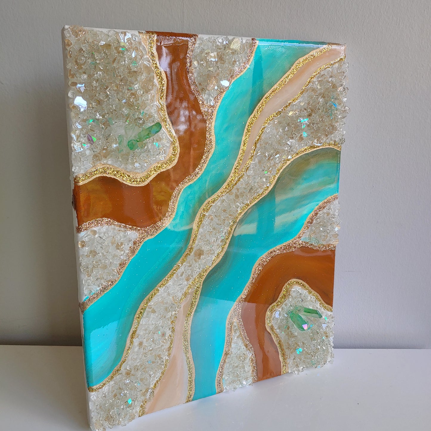 Turquoise and caramel geode artwork with glass and crystals