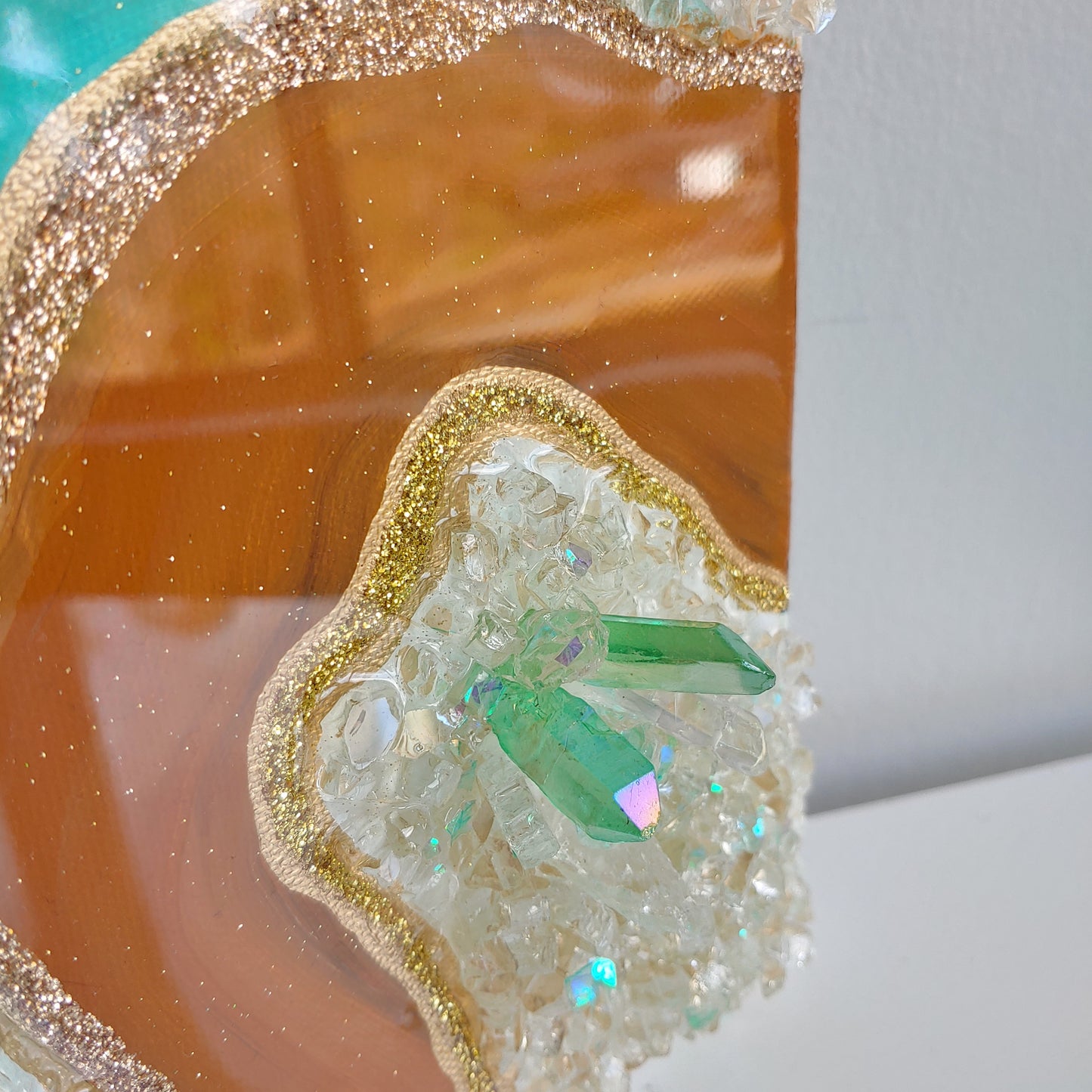 Turquoise and caramel geode artwork with glass and crystals