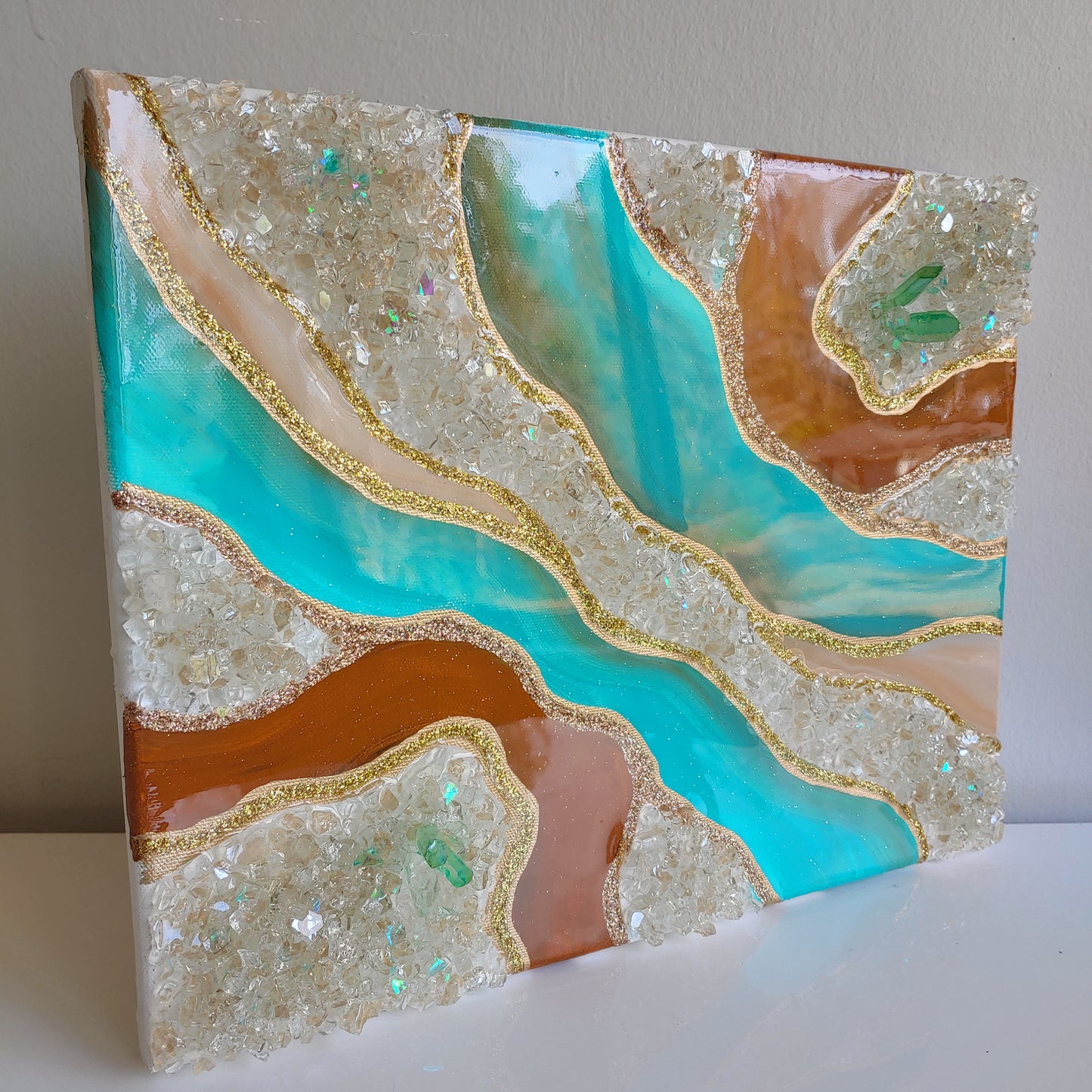 Turquoise and caramel geode artwork with glass and crystals