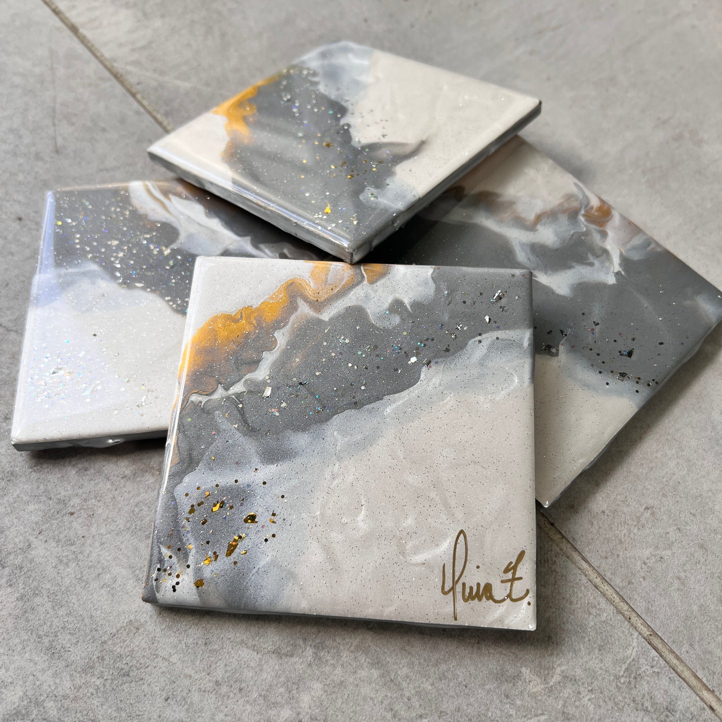 4 pc coasters in white, grey, gold