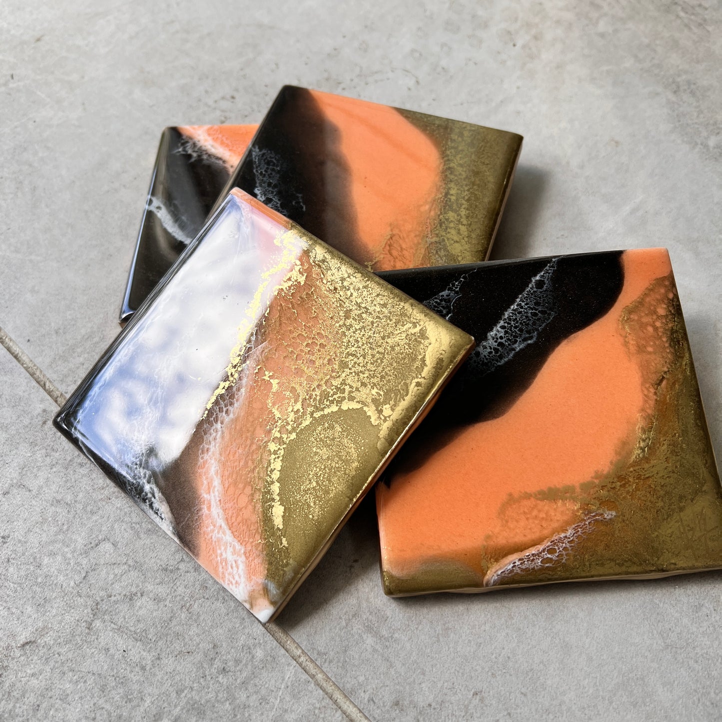 4 pc coasters in coral, brown & gold