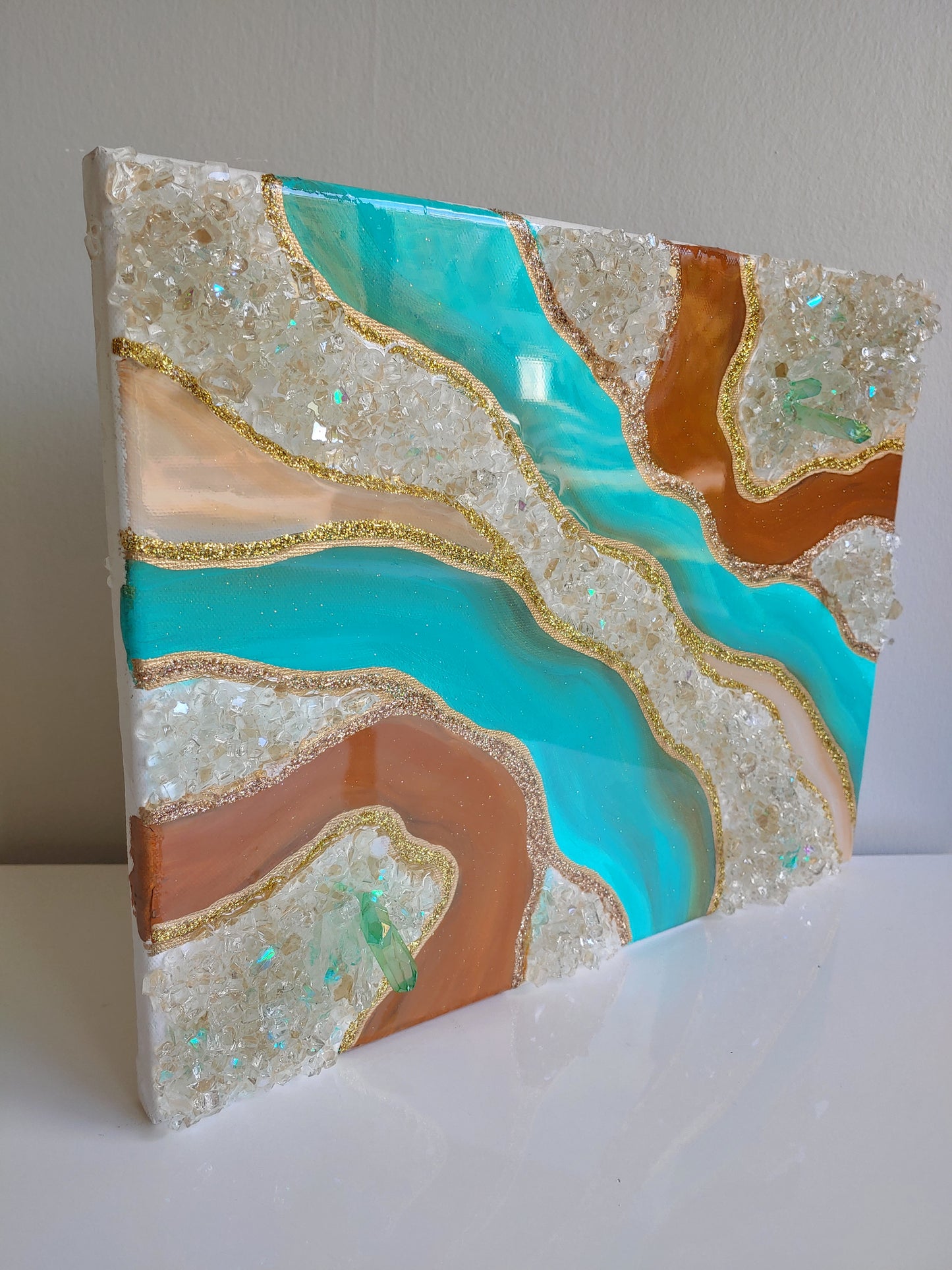 Turquoise and caramel geode artwork with glass and crystals