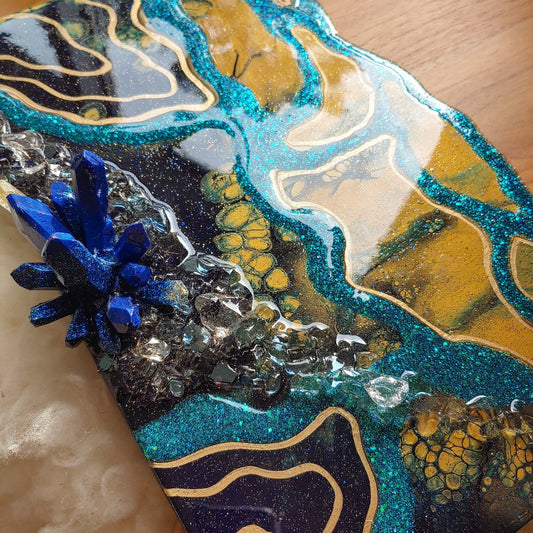 Geode style acacia cheeseboard in navy, turquoise and gold